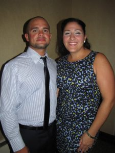 Eddie Gonzales, a 2002 graduate, poses with his wife, Jessica.