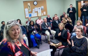 NewBridge CEO welcomes guests to the ribbon-cutting ceremony for the new headquarters.