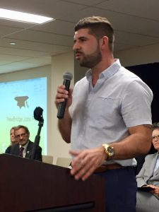 Man speaking with microphone. 